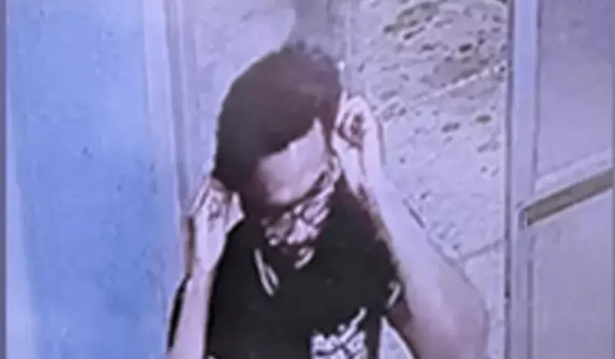 FBI surveillance footage of Inique Hinton, who was charged with attempted destruction of government property on Oct. 23, 2026. (Credit: FBI)