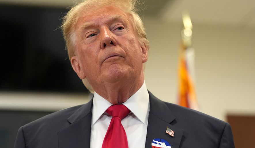 President Donald Trump listens to a question from a reporter after casting his early-voting ballot for the 2026 midterm elections at the Palm Beach County Library in West Palm Beach, Fla., Saturday, Oct. 24, 2026. (AP Photo/Mark Schiefelbein)