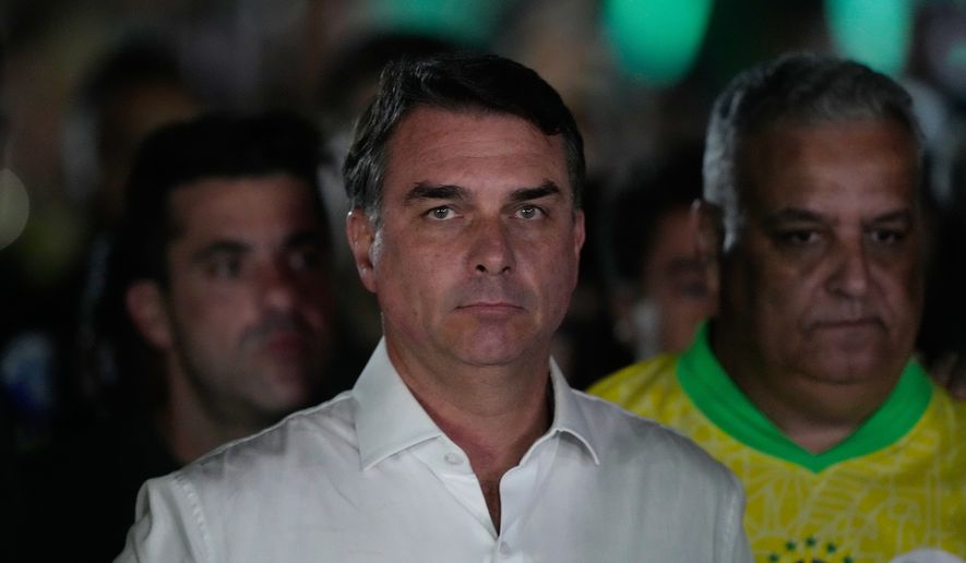 Opposition presidential candidate Sen. Flavio Bolsonaro arrives at his election night event after the presidential runoff in Brasilia, Brazil, Sunday, Oct. 25, 2026.(AP Photo/Eraldo Peres)