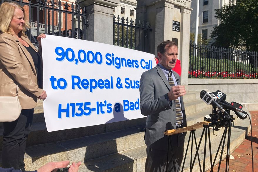 Toby Leary, a gun shop owner and Second Amendment advocate, announces that firearms activists have collected enough signatures to place a question on the Massachusetts 2026 ballot that would repeal the state's new sweeping gun law, Oct. 8, 2024, outside the Massachusetts Statehouse in Boston. (AP Photo/Steve LeBlanc, File)