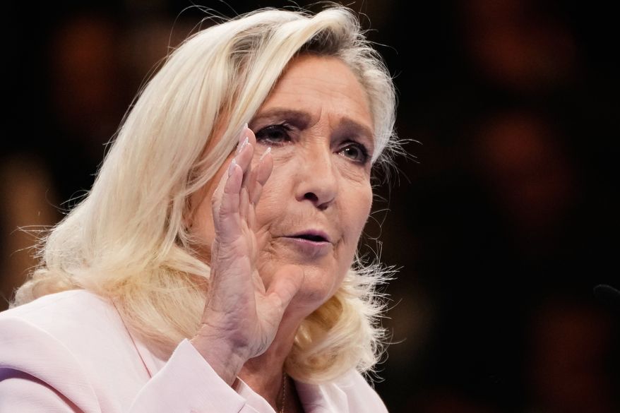 Leader of France's far-right National Rally (RN) party, Marine Le Pen, delivers a speech during the party's 19th Congress, in Orleans, France, Sunday, Oct. 25, 2026. (AP Photo/Teresa Suarez)