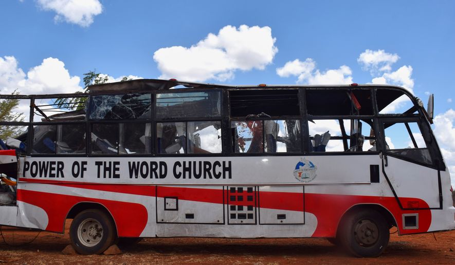 A bus involved in a fatal collision with a truck along the Nairobi-Mombasa Highway is parked at a police station in Makueni County, Kenya, Sunday, Oct. 25, 2026. (AP Photo)