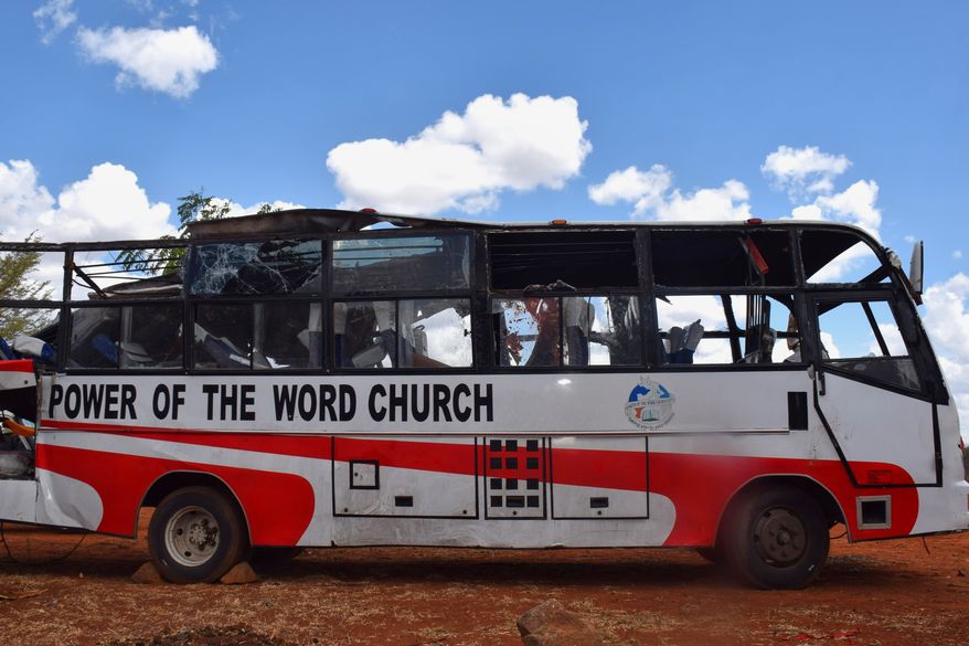A bus involved in a fatal collision with a truck along the Nairobi-Mombasa Highway is parked at a police station in Makueni County, Kenya, Sunday, Oct. 25, 2026. (AP Photo)
