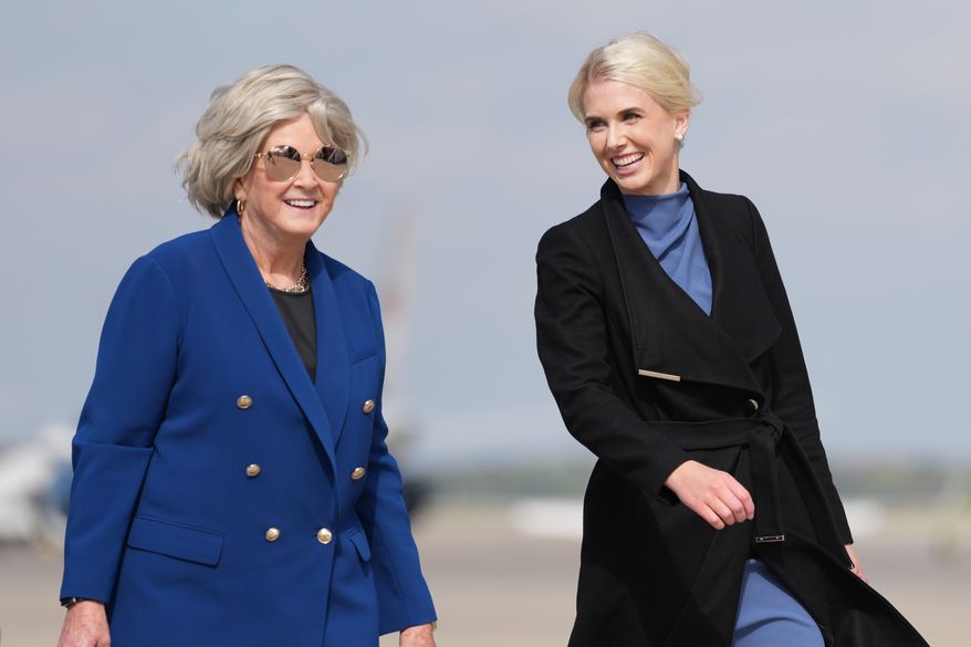 White House chief of staff Susie Wiles and White House aide Natalie Harp walk to board Air Force One, Friday, Oct. 16, 2026, at Joint Base Andrews, Md. (AP Photo/Mark Schiefelbein)