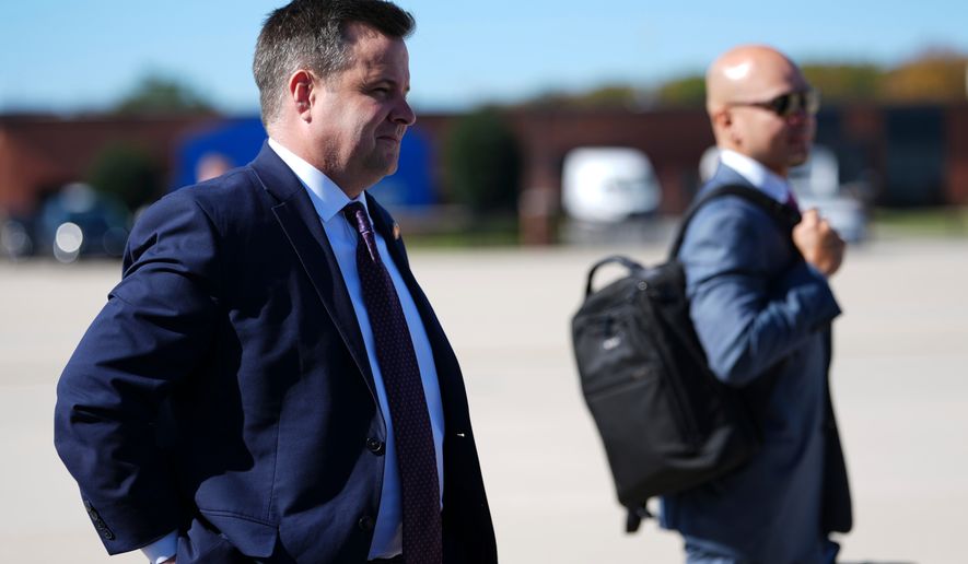 Bill Pulte, director of the Federal Housing Finance Agency, looks on as President Donald Trump speaks with reporters before boarding Air Force One, Sunday, Oct. 25, 2026, at Joint Base Andrews, Md. (AP Photo/Julia Demaree Nikhinson)