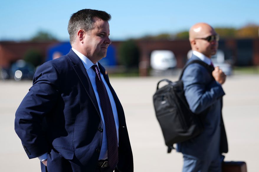 Bill Pulte, director of the Federal Housing Finance Agency, looks on as President Donald Trump speaks with reporters before boarding Air Force One, Sunday, Oct. 25, 2026, at Joint Base Andrews, Md. (AP Photo/Julia Demaree Nikhinson)