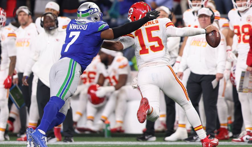 Seattle Seahawks linebacker Uchenna Nwosu (7) pressures Kansas City Chiefs quarterback Patrick Mahomes (15) during the second half of an NFL football game in Seattle, Sunday, Oct. 25, 2026. (AP Photo/Kevin Ng)