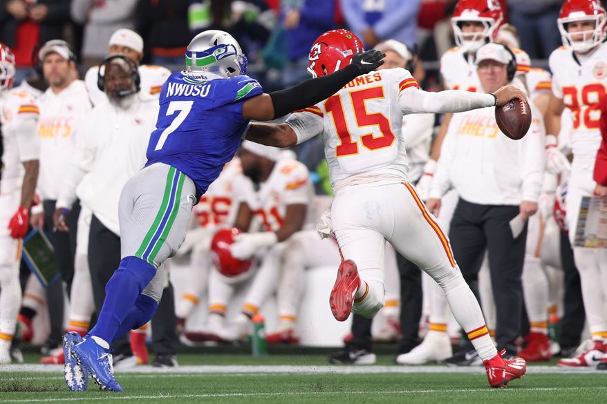 Seattle Seahawks linebacker Uchenna Nwosu (7) pressures Kansas City Chiefs quarterback Patrick Mahomes (15) during the second half of an NFL football game in Seattle, Sunday, Oct. 25, 2026. (AP Photo/Kevin Ng)