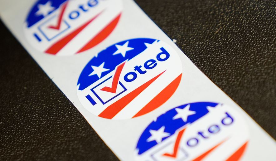 Stickers are seen at an early voting site in Haverstraw, N.Y., Monday, Oct. 26, 2026. (AP Photo/Seth Wenig)