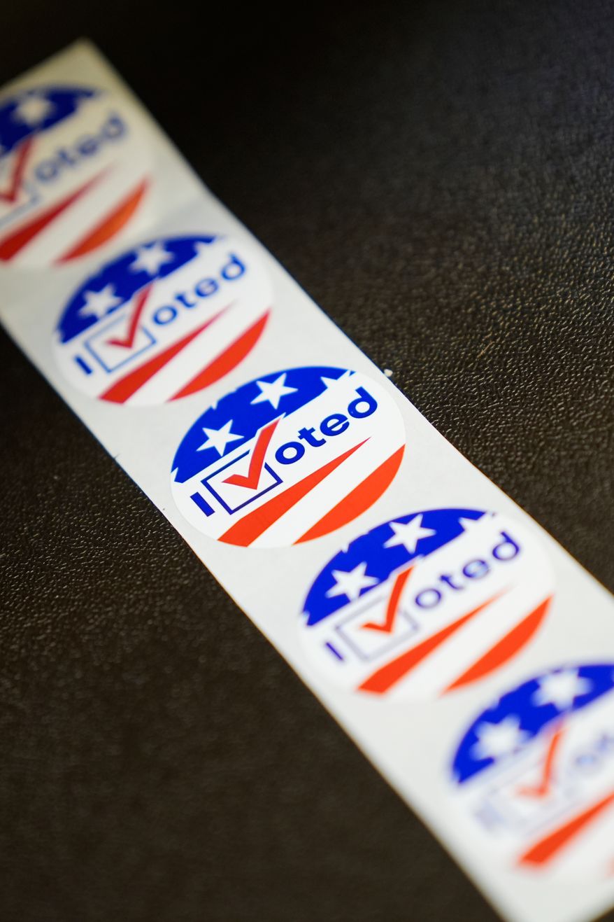 Stickers are seen at an early voting site in Haverstraw, N.Y., Monday, Oct. 26, 2026. (AP Photo/Seth Wenig)