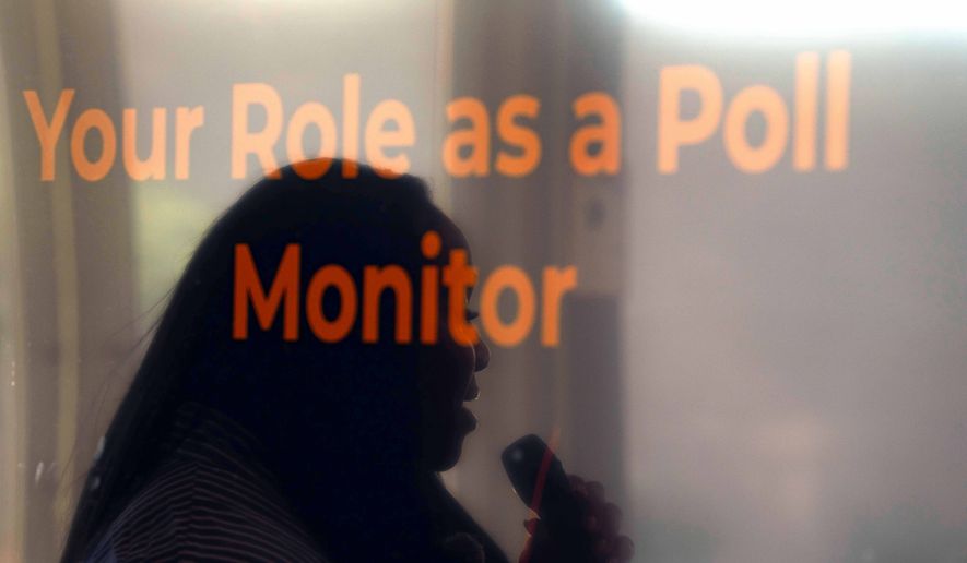 Rev. Medina Moore, an Arizona Faith Network voting rights organizer, is reflected on a television screen during a training for poll chaplains and peacekeepers, Tuesday, Oct. 6, 2026, ahead of the upcoming general midterm election, at Temple Chai in Scottsdale, Ariz. (AP Photo/Rebecca Noble)