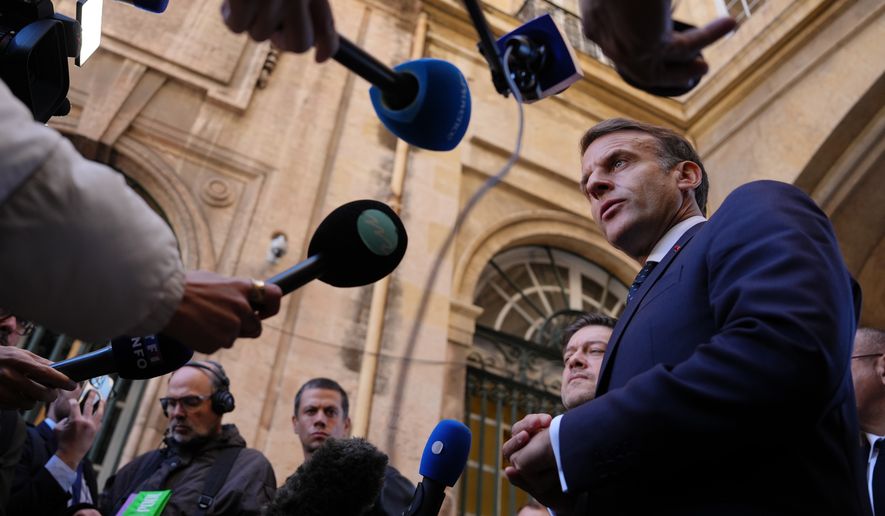 French President Emmanuel Macron addresses the media in Marseille, France, Monday, Oct. 26, 2026. (AP Photo/Aurelien Morissard, Pool)