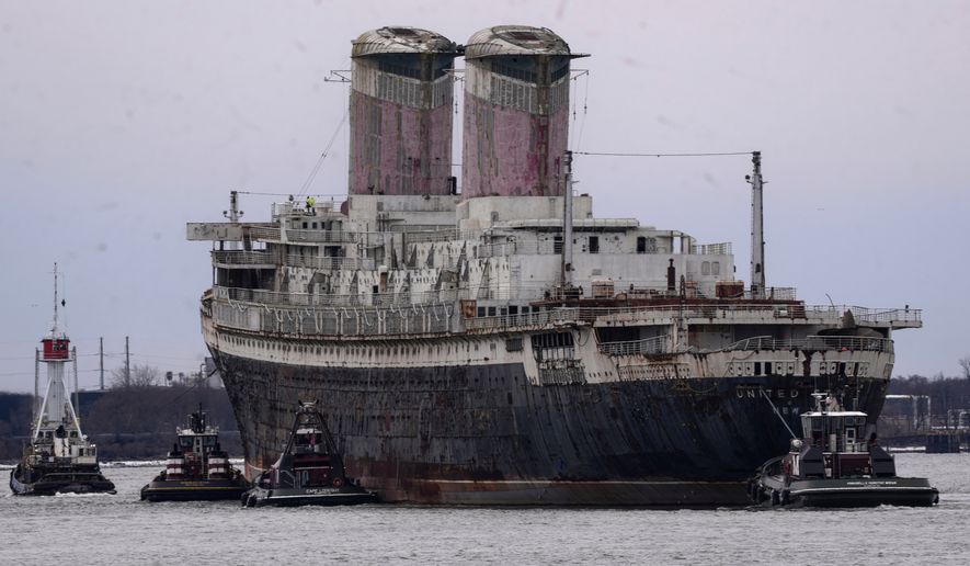 The SS United States is towed down the Delaware River between Pennsylvania and New Jersey, from Philadelphia, Wednesday, Feb. 19, 2025. (AP Photo/Matt Rourke, File)