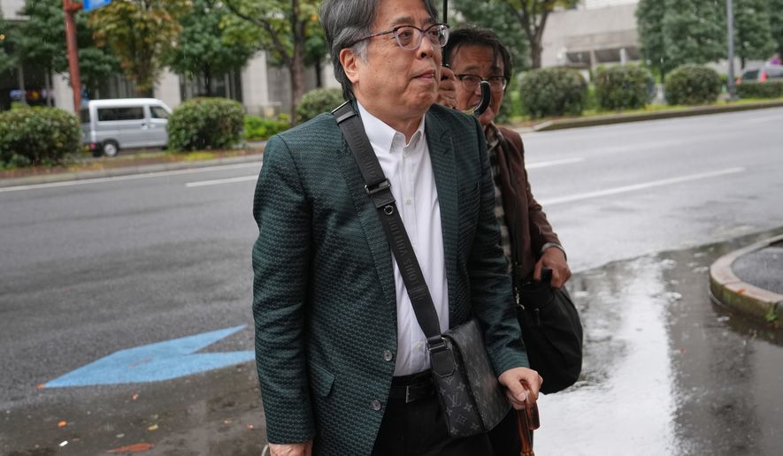 Japanese manga artist Yoshinori Kobayashi, who has written books on history and monarchy, arrives at the Tokyo District Court in Tokyo, Monday, Oct. 26, 2026. (AP Photo/Eugene Hoshiko)