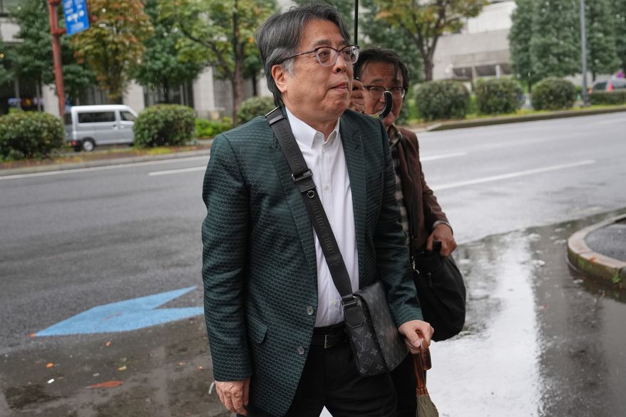 Japanese manga artist Yoshinori Kobayashi, who has written books on history and monarchy, arrives at the Tokyo District Court in Tokyo, Monday, Oct. 26, 2026. (AP Photo/Eugene Hoshiko)