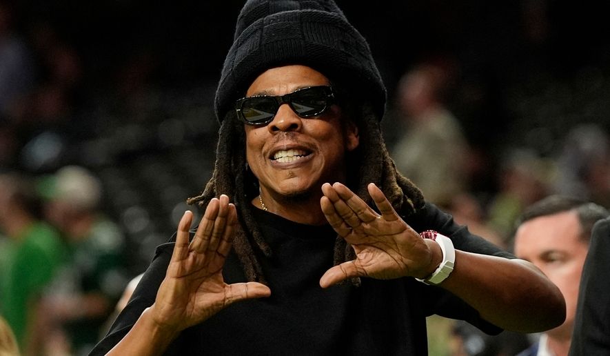 Jay-Z gestures from the sidelines prior to the NFL Super Bowl 59 football game, Feb. 9, 2025, in New Orleans. (AP Photo/Frank Franklin II, File)