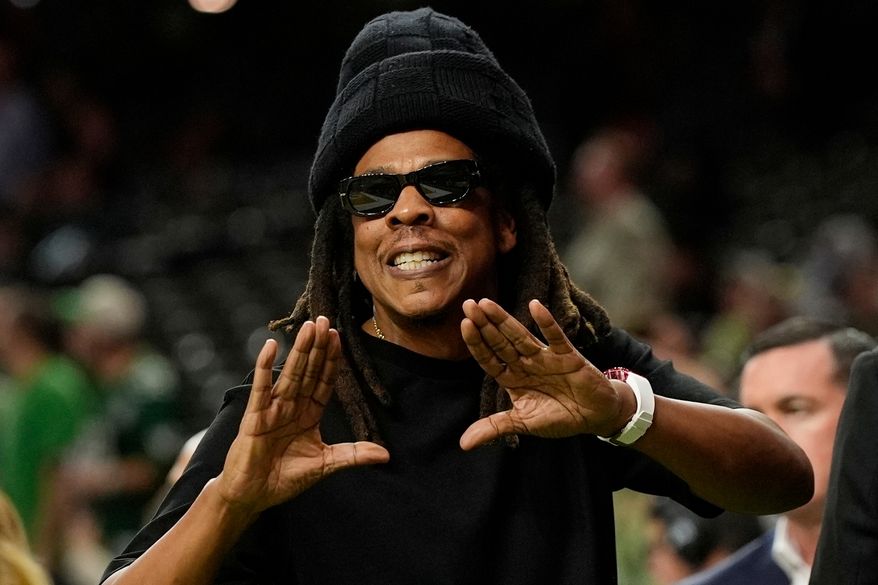 Jay-Z gestures from the sidelines prior to the NFL Super Bowl 59 football game, Feb. 9, 2025, in New Orleans. (AP Photo/Frank Franklin II, File)