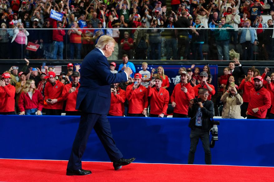 President Donald Trump arrives to speak during a campaign rally at McMorran Place Sports and Entertainment Center, Sunday, Oct. 25, 2026, in Port Huron, Mich. (AP Photo/Julia Demaree Nikhinson)