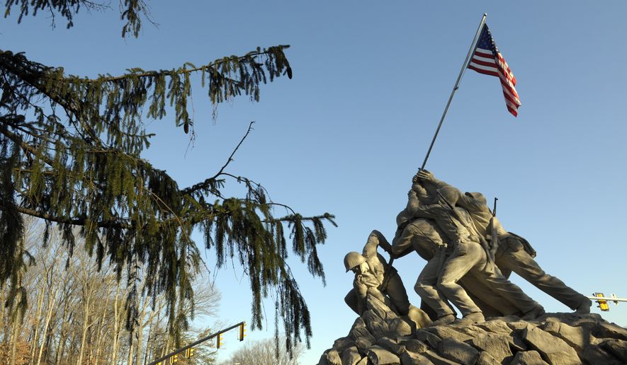 An Iwo Jima Memorial tribute statue is seen at the entrance to the main gate at Quantico Marine Corps Base in Quantico, Va., Friday, March 22, 2013. (AP Photo/Cliff Owen)