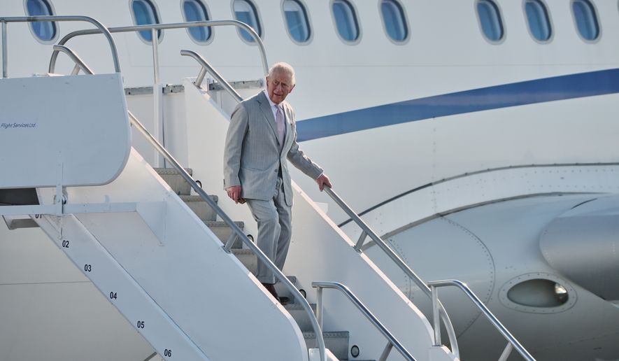 Britain's King Charles III deplanes at Lynden Pindling Airport in Nassau, Bahamas, Tuesday, Oct. 27, 2026. (AP Photo/Tim Aylen)