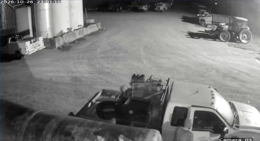 This image from security video provided by John Lindamood shows escaped inmate Jacob Allen Morley, bottom right, stealing a white Ford F-350 from the Lindamood Planting Company early Monday, Oct. 26, 2026, in Lake County, Tenn. (John Lindamood via AP)