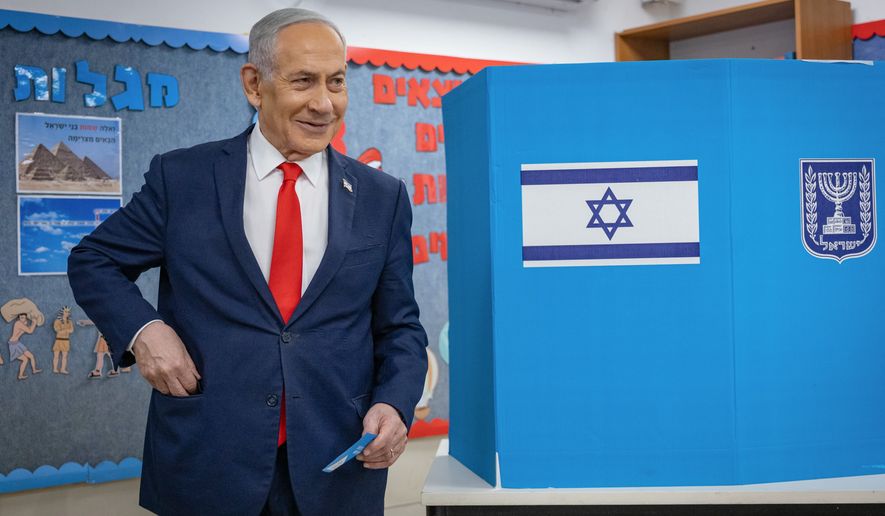 Israel's Prime Minister Benjamin Netanyahu reacts after filling out his ballot before voting at a polling station in Jerusalem, Tuesday, Oct. 27, 2026. (Yonatan Sindel /Pool Photo via AP)