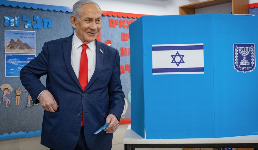 Israel's Prime Minister Benjamin Netanyahu reacts after filling out his ballot before voting at a polling station in Jerusalem, Tuesday, Oct. 27, 2026. (Yonatan Sindel /Pool Photo via AP)