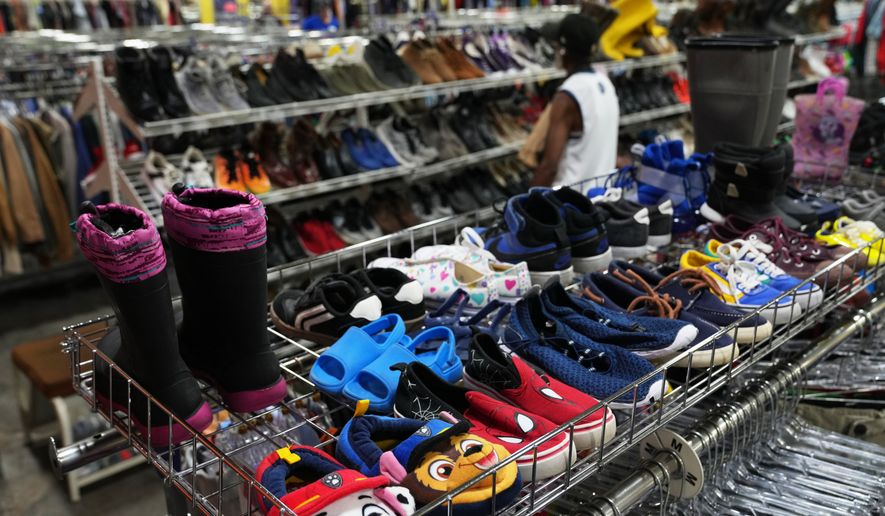 FILE - The children's shoe section is seen at a Goodwill store in Roseville, Minn., Aug. 12, 2026. (AP Photo/Ellen Schmidt, File)