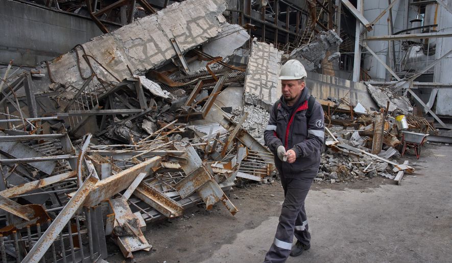 A worker walks through a destroyed workshop at the Trypilska Thermal Power Plant in Ukrainka, Kyiv region, Ukraine, Monday, Oct. 26, 2026, following a recent Russian missile attack. (AP Photo/Efrem Lukatsky)
