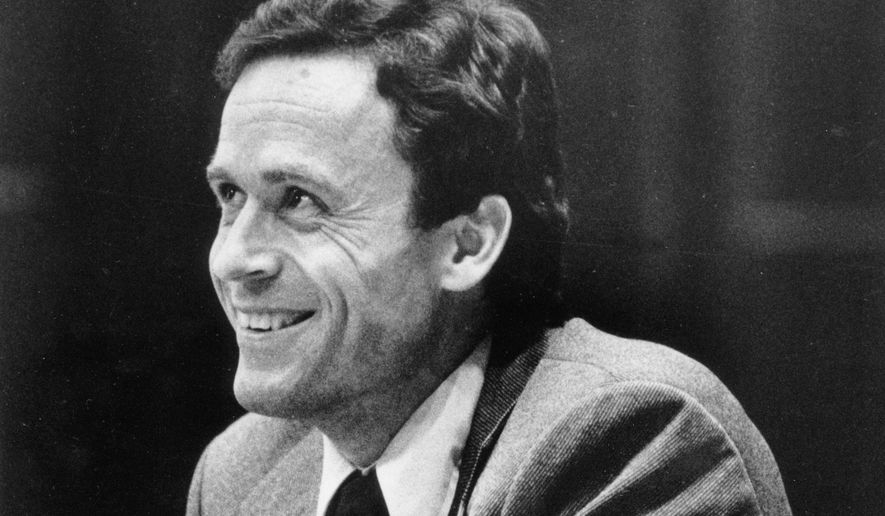 FILE - Ted Bundy smiles during the second day of jury selection for his murder trial in a Dade County courtroom in Miami, June 27, 1979. (AP Photo, Pool, File)