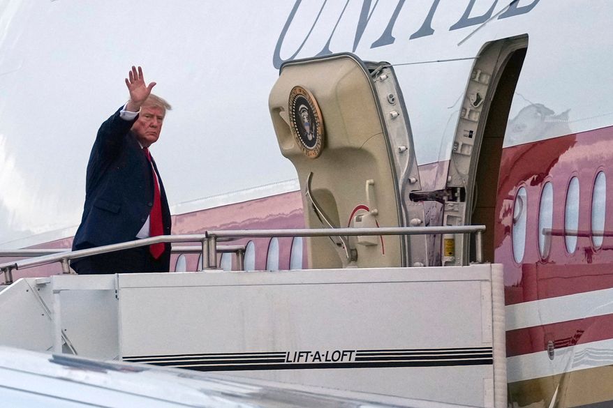 President Donald Trump waves as he boards Air Force One, Sunday, Oct. 25, 2026, at Selfridge Air National Guard Base, Mich. (AP Photo/Julia Demaree Nikhinson)