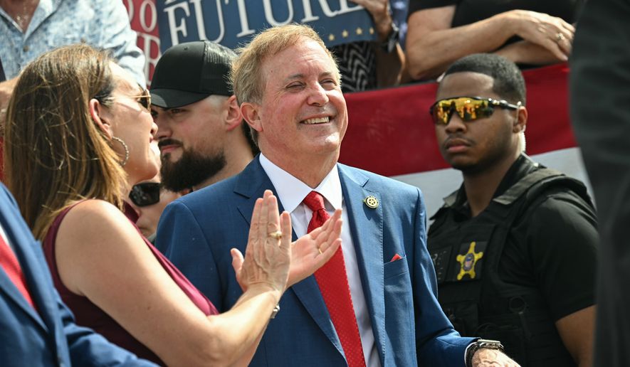 Texas Attorney General and Republican Senate candidate Ken Paxton smiles as Vice President JD Vance speaks during a campaign rally at Tyler Pounds Regional Airport in Tyler, Texas, Tuesday, Oct. 13, 2026. (Saul Loeb/Pool Photo via AP, File)