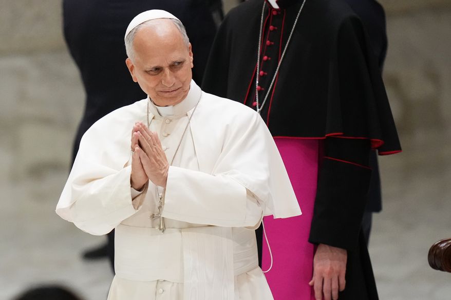 Pope Leo XIV greets participants in an audience with the Jesus Youth International Conference in the Paul VI Hall at the Vatican, Saturday, Oct. 24, 2026. (AP Photo/Alessandra Tarantino)