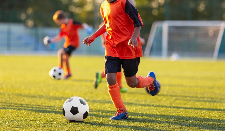 Kids in soccer training. File photo credit: matimix via Shutterstock.