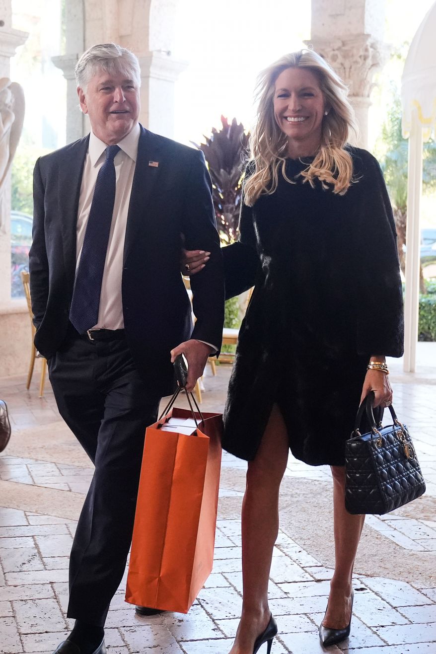 Sean Hannity and Ainsley Earhardt arrive at The Mar-a-Lago Club, Sunday, Feb. 1, 2026, in Palm Beach, Fla., to attend the wedding of White House deputy chief of staff Dan Scavino and Erin Elmore, the director of Art in Embassies at the U.S. Department of State. (AP Photo/Mark Schiefelbein)