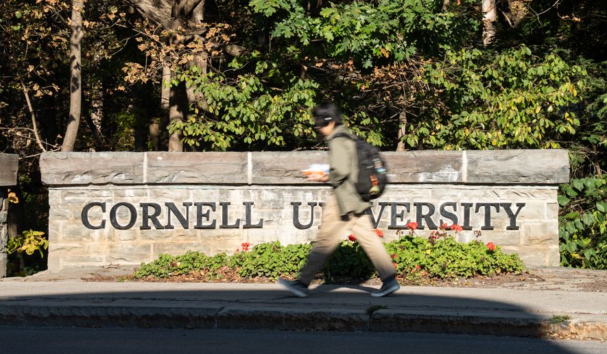 Students walk through Cornell University's campus, Wednesday, Oct. 7, 2026, in Ithaca, N.Y. (AP Photo/Matt Burkhartt)