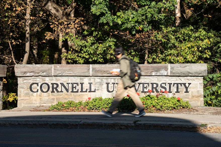 Students walk through Cornell University's campus, Wednesday, Oct. 7, 2026, in Ithaca, N.Y. (AP Photo/Matt Burkhartt)