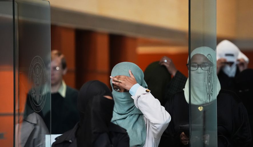 Supporters of Salim Said, who was found guilty in the Feeding Our Future fraud scheme, leave after Said's sentencing hearing, Wednesday, Oct. 28, 2026, in Minneapolis. (AP Photo/Ellen Schmidt)