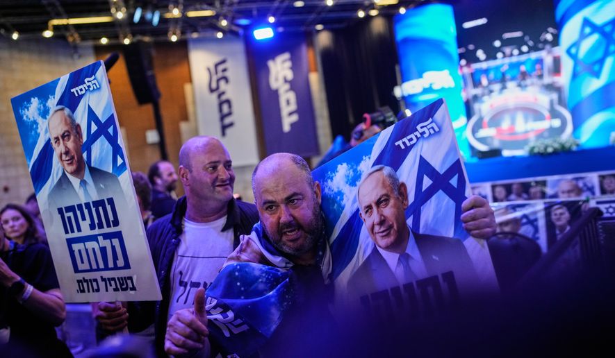 Supporters of Israeli Prime Minister Benjamin Netanyahu react to the release of the first exit poll results in Israel's general election in Jerusalem on Tuesday, Oct. 27, 2026. (AP Photo/Ohad Zwigenberg)