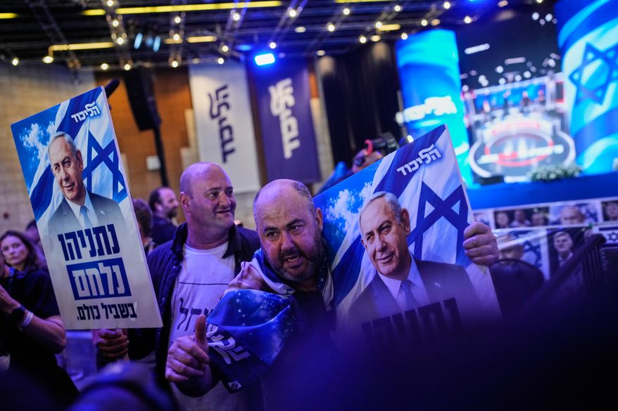 Supporters of Israeli Prime Minister Benjamin Netanyahu react to the release of the first exit poll results in Israel's general election in Jerusalem on Tuesday, Oct. 27, 2026. (AP Photo/Ohad Zwigenberg)