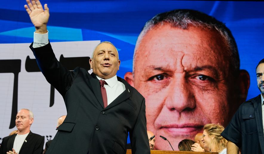 Gadi Eisenkot, leader of the Yashar ("Straight") party, waves to supporters following the release of the first exit poll results in Israel's general election in Tel Aviv, Israel, Wednesday, Oct. 28, 2026. (AP Photo/Baz Ratner)