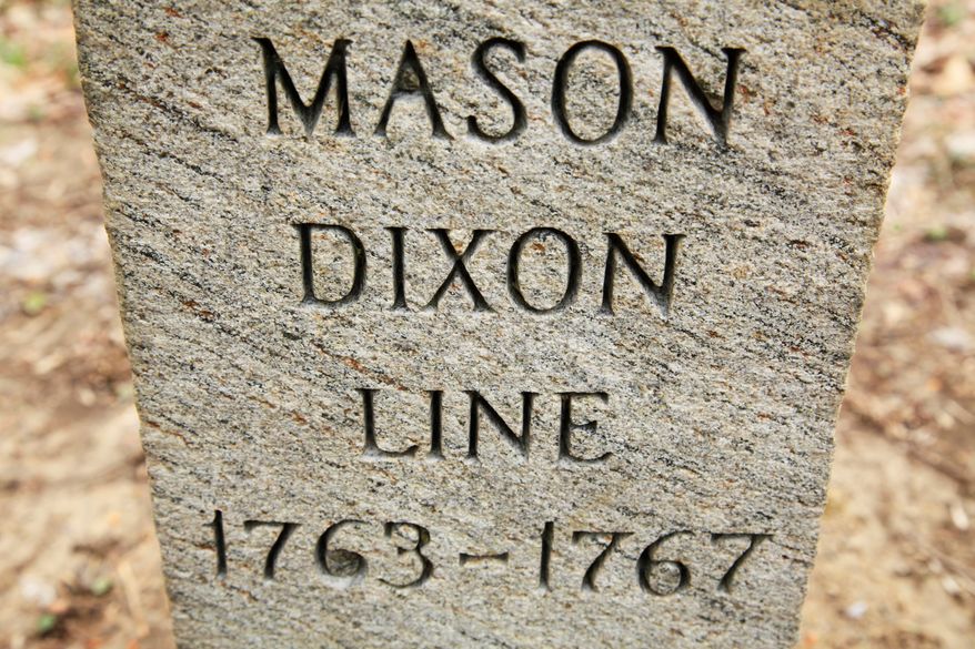 In this Friday, April 15, 2011, photo in Newark Del., shown is a post marking the base point in the survey of Charles Mason and Jeremiah Dixon. Mason and Dixon began their survey a century before the Civil War to settle a border dispute between Pennsylvania and Maryland. (AP Photo/Matt Rourke, File)