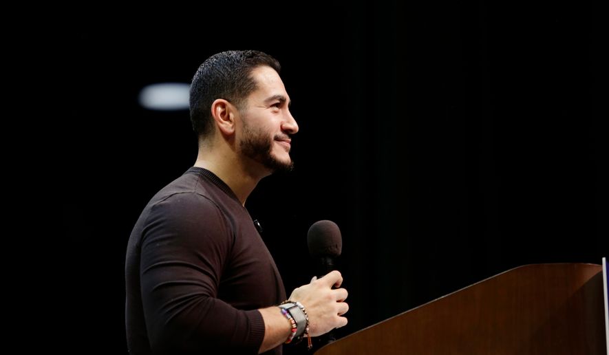 Michigan Senate candidate Abdul El-Sayed speaks to a crowd during a rally, Sunday, Oct. 25, 2026, in Grand Rapids, Mich. (AP Photo/Kristen Norman)