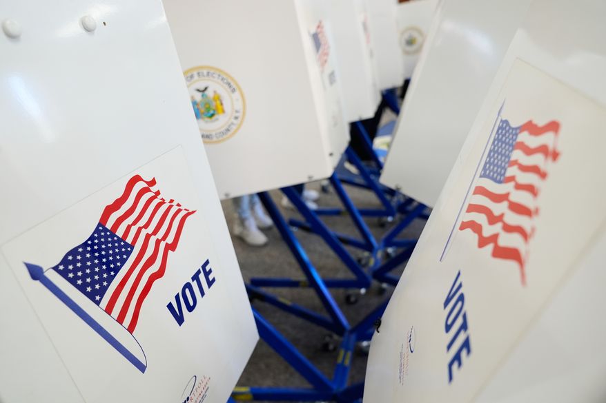 Voters use privacy booths to fill out their ballots at an early voting site in Haverstraw, N.Y., Monday, Oct. 26, 2026. (AP Photo/Seth Wenig)