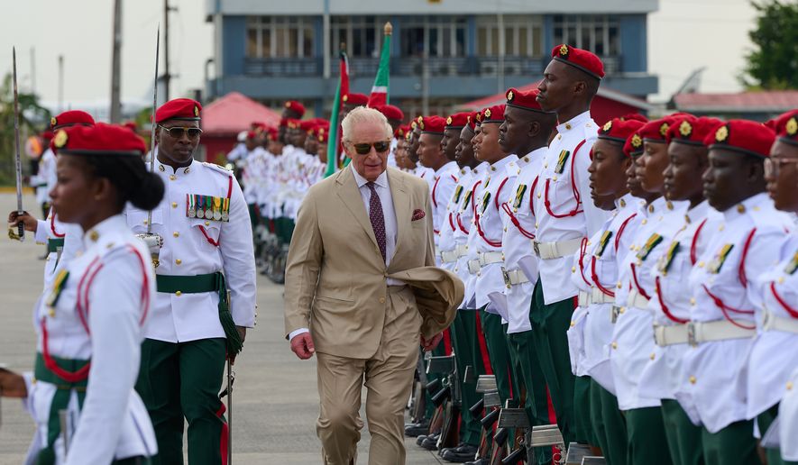 Britain's King Charles III inspects the guard of honor on his arrival at Cheddi Jagan International Airport in Georgetown, Guyana, Thursday, Oct. 29, 2026. (AP Photo/Delano Williams)