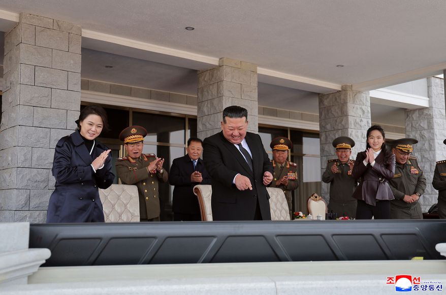 In this photo provided on Oct. 30, 2026, by the North Korean government, its leader Kim Jong Un, center, his wife Ri Sol Ju, left, and their daughter, front right, watch the monitors showing the demonstrations held at an exhibition of a variety of attack and other drones at the Wonsan-Kalma coastal tourist area, North Korea, Thursday, Oct. 29, 2026. Independent journalists were not given access to cover the event depicted in this image distributed by the North Korean government. The content of this image is as provided and cannot be independently verified. Korean language watermark on image as provided by source reads: "KCNA" which is the abbreviation for Korean Central News Agency. (Korean Central News Agency/Korea News Service via AP)