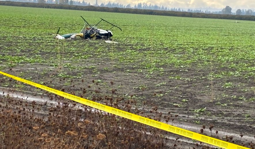 This photo released by the Yamhill County Sheriff's Office shows a damaged helicopter after two helicopters collided and crashed into a farm field in Yamhill County, Ore. Thursday, Oct. 29, 2026. (Yamhill County Sheriff's Office via AP)