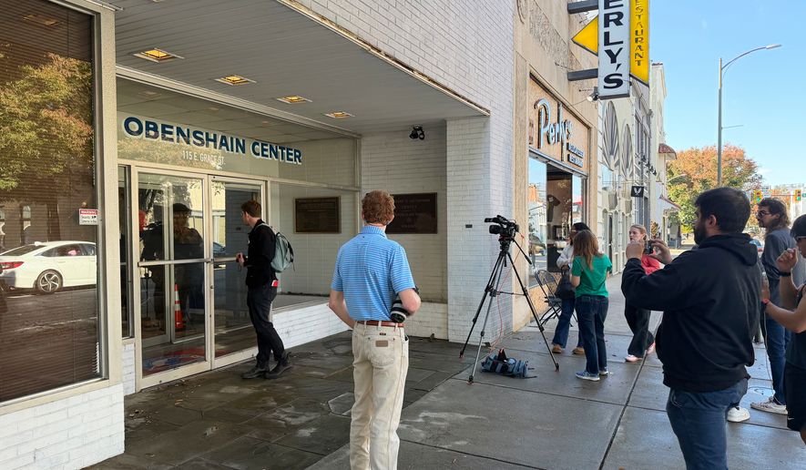 Reporters gather outside the Obenshain Center on Thursday, Oct. 29, 2026, in Richmond, Va. (AP Photo/Sarah Rakin) Photo taken with a smartphone.