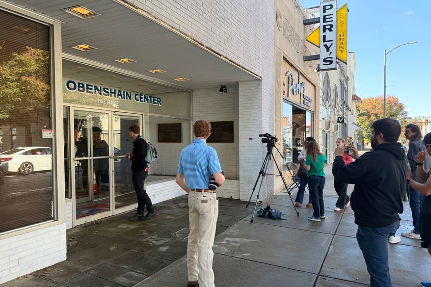 Reporters gather outside the Obenshain Center on Thursday, Oct. 29, 2026, in Richmond, Va. (AP Photo/Sarah Rakin) Photo taken with a smartphone.