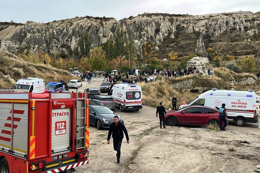 Emergency teams work in the aftermath where parts of a volcanic rock formation collapsed in Cappadocia, central Turkey, Thursday, Oct. 29, 2026. (Turan Bulut/IHA via AP)